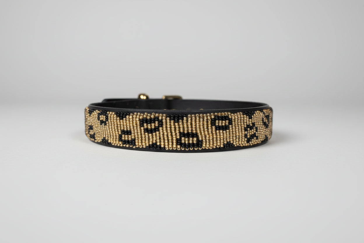 Beaded collar on a beige surface with a blurred indoor background