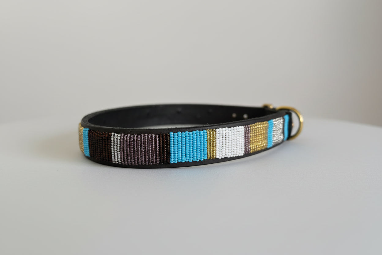 Dog collar with colorful beaded design on a light grey background