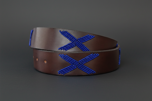 Brown leather belt with blue decorative 'X' pattern on a white background