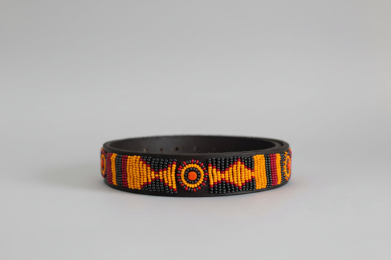 Beaded dog collar with yellow and pewter pattern on a grey background