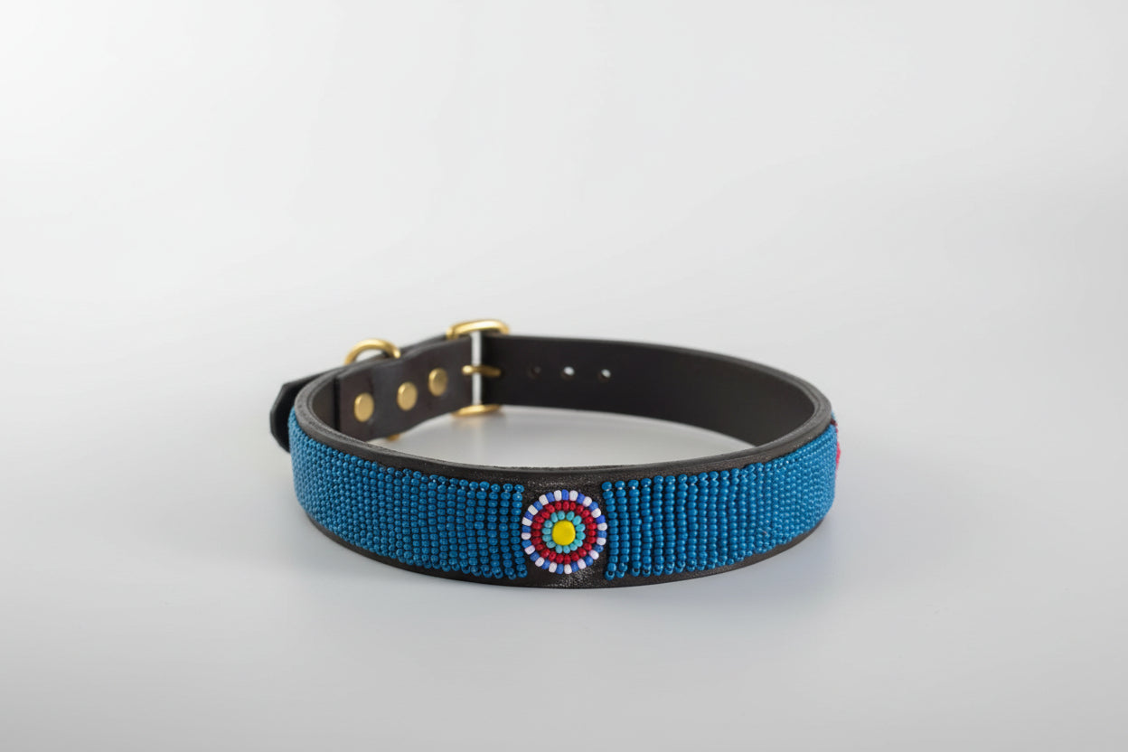 Blue beaded collar with a decorative center on a white background
