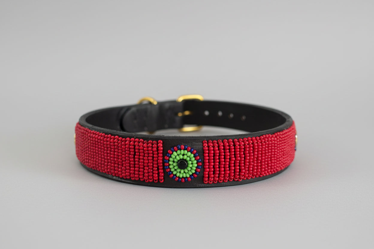 Red beaded dog collar with a decorative center piece 