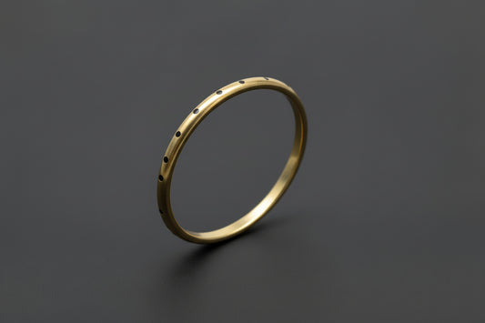 Gold oval brass bangle 
